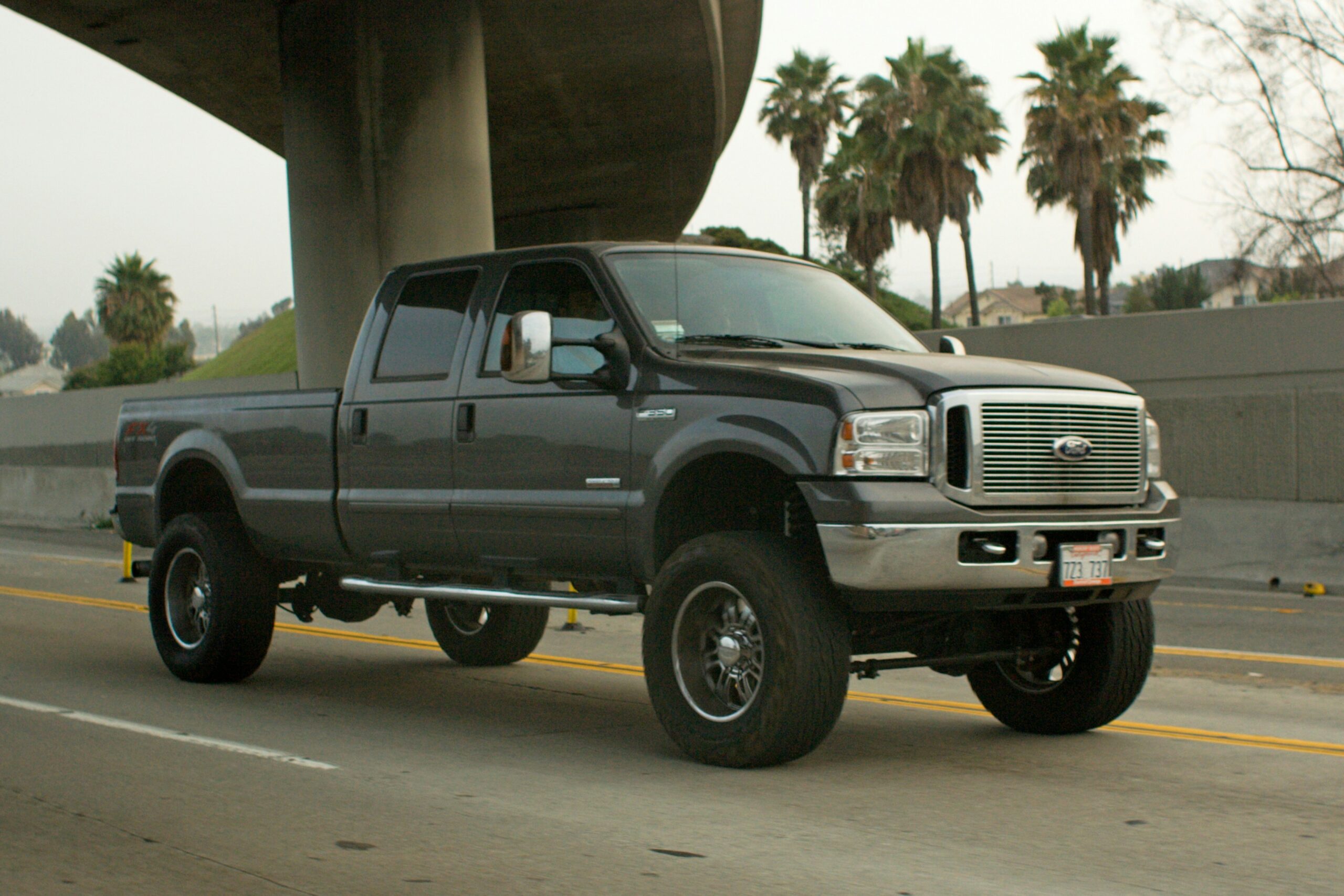 travel across state lines with a firearm modern Ford truck driving across an interstate on a long road trip