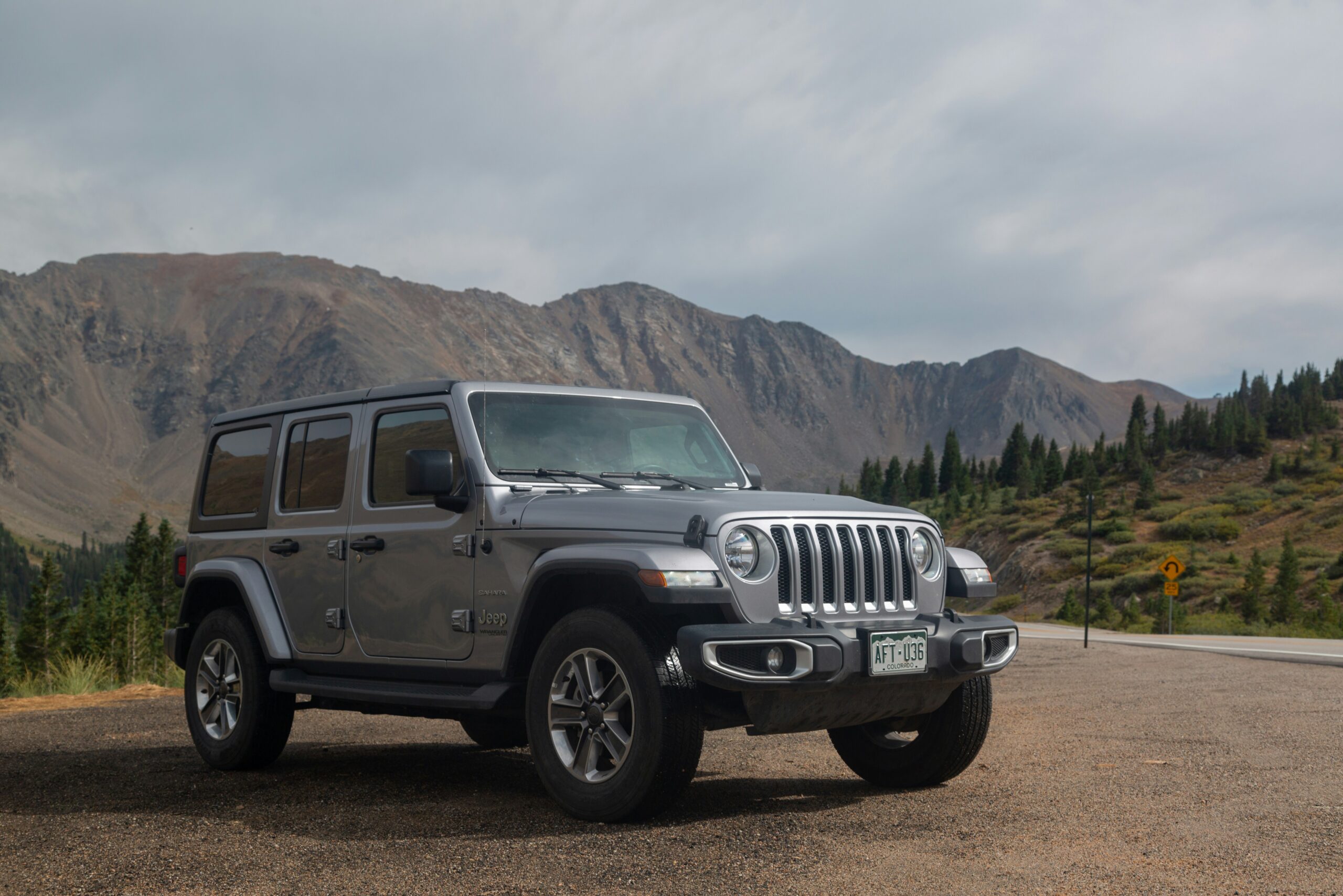 best vehicle holster for Jeep owners grey Jeep Wrangler parked on a Colorado trail